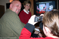Dylan taking a picure of Mommy and Uncle Jim... You can see the picture he's composed in the LCD screen!