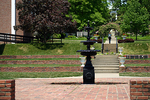 A water fountain and circular sitting area in the center of the Belmont University campus.