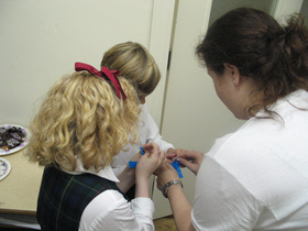 camp-counselor-assisting-young-children.jpg