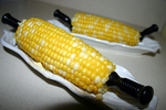 Ears of corn-on-the-cob... complete with corn shaped plates and 
corn cob holders.