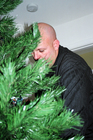 Photo from the ONE year we got into the holiday spirit and tried decorating a Christmas Tree. Here's Jim stringing holiday lights on our first Christmas Tree together.