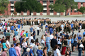 Friends and family members rushed down from the bleachers to hug their graduates!