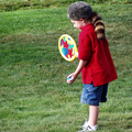 Some hand-me-down toys. Children can turn even the simplest things into fun times... from a Daniel Boone cap to boomerangs and paddle balls.