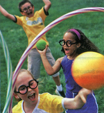 Children playing the game from the Harry Potter movies, Quidditch.  Photo (C) Better Homes & Gardens