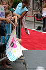 A young fan with a homemade poster that says, 'I Love Orlando Bloom'.