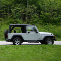 2004 Jeep Wrangler Unlimited parked in the green grass of Gatlinburg, Tennessee.