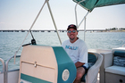 Jim driving the pontoon boat we rented for the day in Pensacola, Florida.