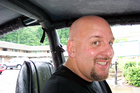 Jim soaking wet inside our Jeep rental.
