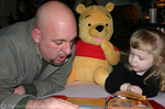 Karly reading to Uncle Jim.
