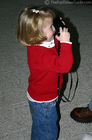 Karly trying out Daddy's film camera.