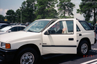Lynnette in her Isuzu Rodeo enjoying life in Orlando, Florida.