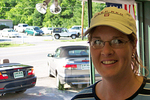 Lynnette at the used car dealership signing some papers and leaving a deposit for the Jeep Wrangler Unlimited that you see in the background.