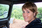 Lynnette soaking wet inside our Jeep rental.