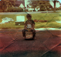Back in the day... This is my brother on a hand-me-down ride-along toy. I made him pose for this photo when we were playing with my dolls... He's gonna kill me if he sees this!