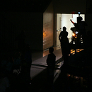 Pastor Dave's entrance took the form of a loud, revving engine passing through the crowd in the darkness toward the stage...