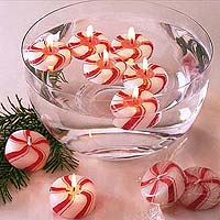 Floating Peppermint Candy Candles - each peppermint scented candle is individually wrapped like a piece of candy and the set is cello-bagged and tied with a red ribbon.