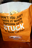 A popcorn bag with a built-in flosser!