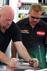 Jim and Terry taking turns at a very strenuous sanding job on some important part of the car.