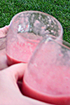 A couple of half-empty Strawberry Smoothie glasses.