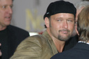 The cameras catch Tim McGraw wearing a silly grin.