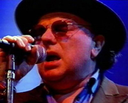 Van Morrison singing with a microphone in his hand. van-morrison.jpg
