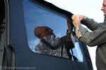 Jim removing the vinyl windows in our Jeep during the Fall.