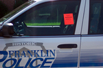 Warning sticker placed on a police car parked on the street in our subdivision.