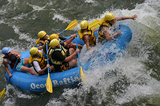 A boatload of whitewater rafters at Hell's Hole rapid on the lower Ocoee River.