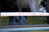 Doggie window bumper which serves as a chin resting spot on the car window.
