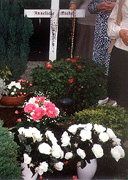 People viewing the grave of Anneleise Michel.