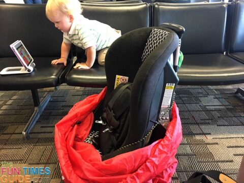 Here you can see how the car seat with luggage cart attached fits nicely inside the Car Seat Gate Check Bag.