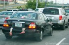 Humorous prank: Car with a body in the trunk.
