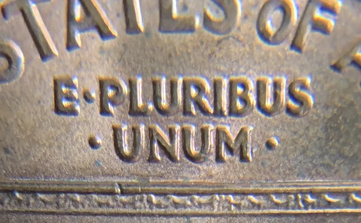 Why is E Pluribus Unum on coins like the Lincoln Memorial penny, as seen here?