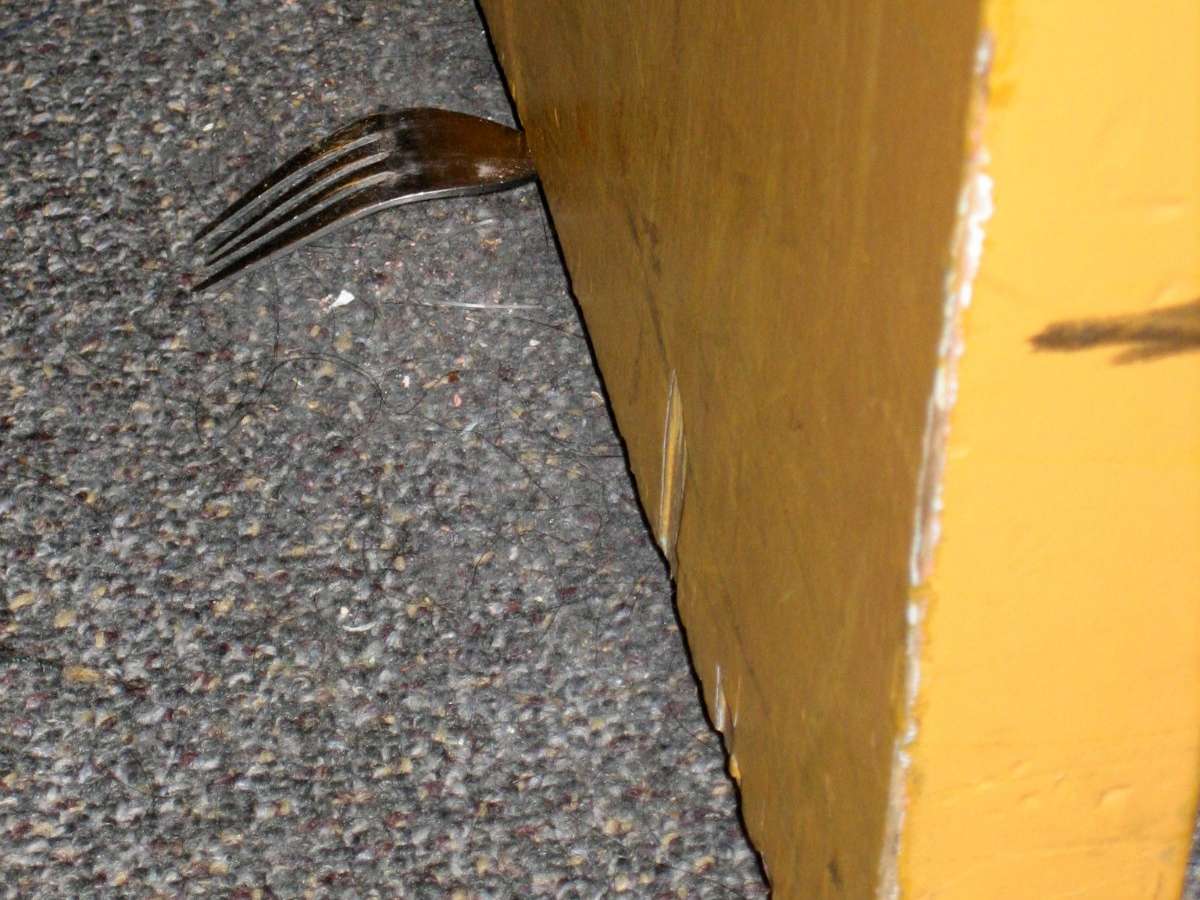 A fork used as a DIY door stop as featured on The Daily Clog.