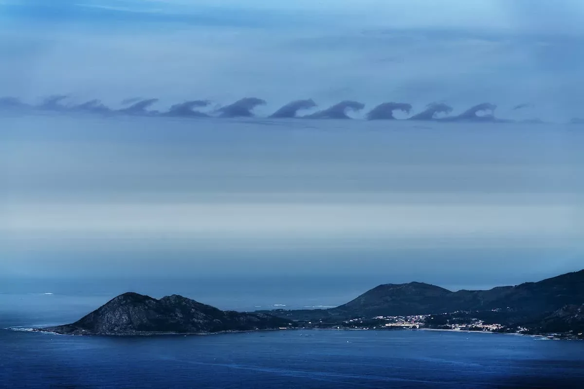 Kelvin-Helmholtz wave clouds as seen from a distance.