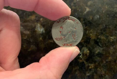 The mystery behind the red quarter has been solved! Here's what red quarters mean and how much they're worth.
