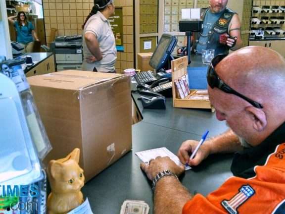 Here Jim is addressing the label to ship our box of "stuff" home from the Sturgis Rally. 