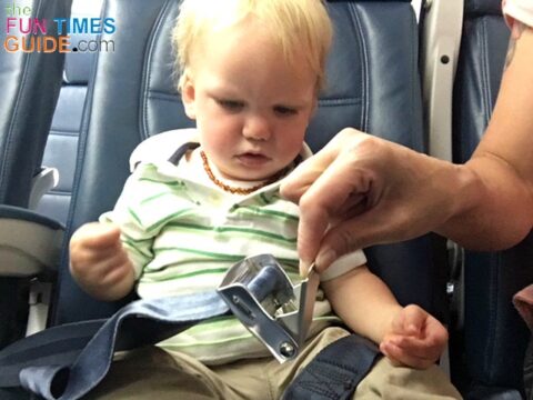 When using a car seat on a plane, you definitely need to consider how your car seat will be secured on the plane -- keeping the airplane lap belt buckle in mind. photo by Candida at TheFunTimesGuide.com When using a car seat on a plane, you definitely need to consider how your car seat will be secured on the plane -- keeping the airplane lap belt buckle in mind.